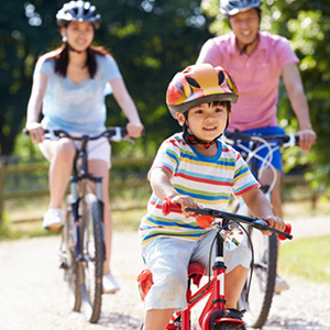 Family riding bikes to stay active
