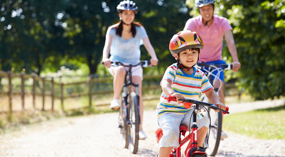 Family riding bikes to stay active